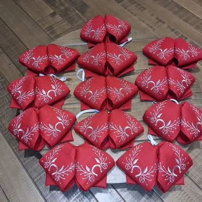 Red mariachi monos with silver embroidered floral design