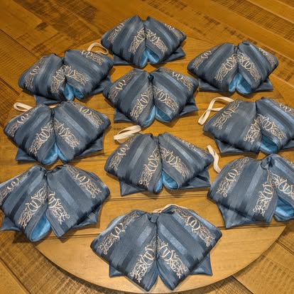 Slate blue mariachi monos with gold embroidered design