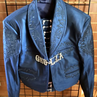 Navy blue mariachi traje jacket with embroidered floral design