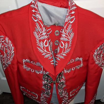 Red mariachi traje jacket with silver floral embroidery and silver botonadura